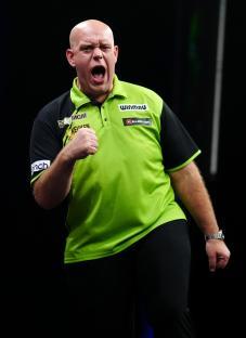 Michael van Gerwen celebrating during a darts match.
