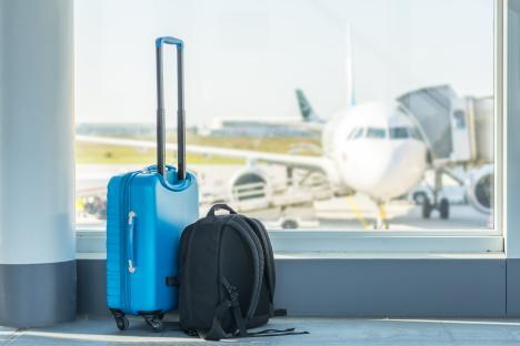 Suitcase and backpack at an airport.