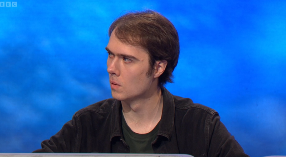 A young man on a BBC quiz show looking confused.