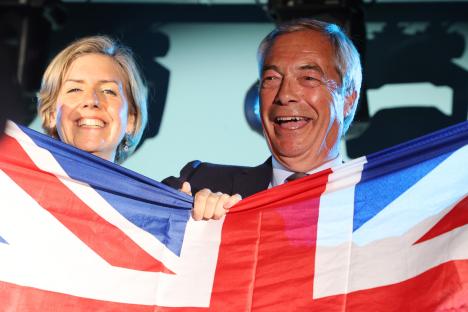 Nigel Farage and Andrea Jenkins holding a Union Jack flag.