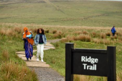 Two women walking on a Ridge Trail.