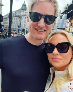Couple wearing sunglasses in London.