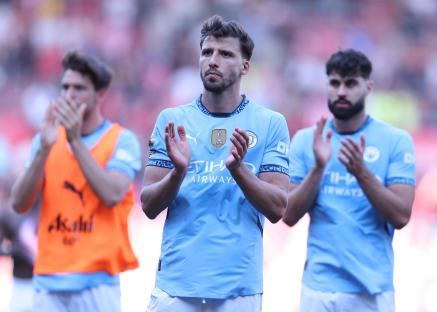 Ruben Dias of Manchester City applauding fans.