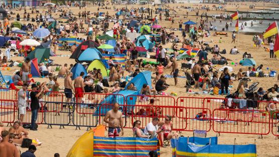 Thousands of Brits flock to beaches to soak up glorious sunshine as temps set to hit 34C in just days