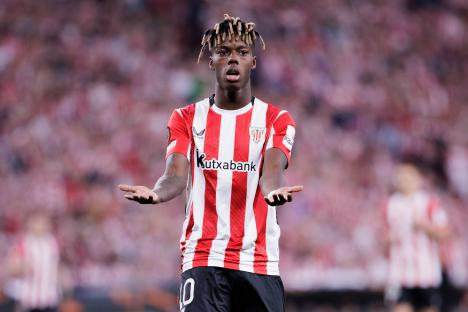 Nico Williams of Athletic Club de Bilbao reacting to a missed opportunity during a soccer match.