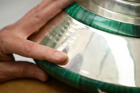 Close-up of the Premier League trophy engraved with Liverpool's name as 2025 champions.