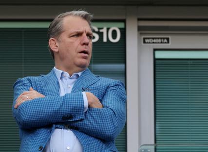 Todd Boehly, co-owner and chairman of Chelsea, stands with his arms crossed.
