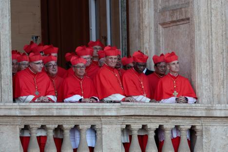 Cardinals on a balcony at the Vatican.