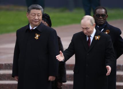 Presidents Putin and Xi Jinping at a wreath-laying ceremony.