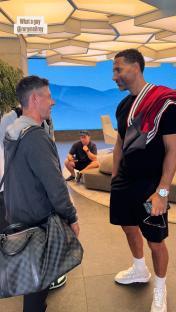 Rio Ferdinand and Rory McIlroy in conversation.