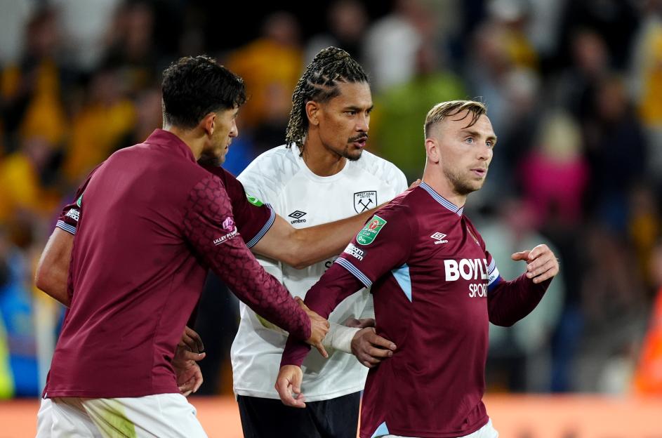 Jarrod Bowen of West Ham United being restrained by teammates after a match.