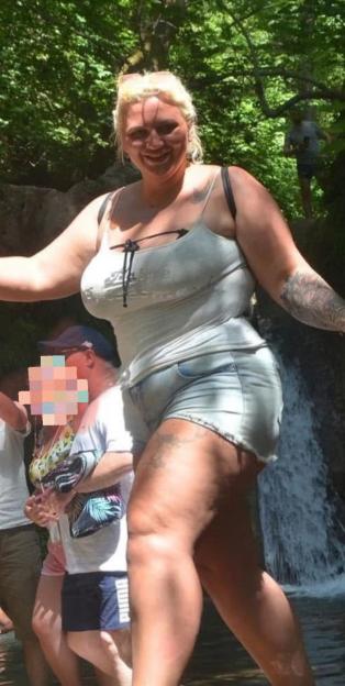 Photo of Paige Ospray near a waterfall.