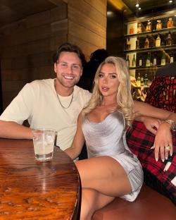 Photo of a couple sitting at a table in a restaurant.