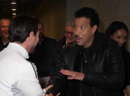 Collage of Lionel Messi meeting Lionel Richie.