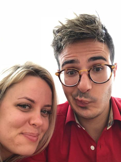 Photo of a couple posing for a selfie.
