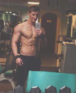 Man taking a selfie in a gym before his cancer diagnosis.