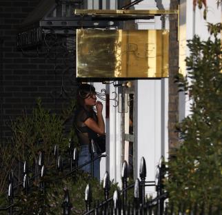 Woman outside Core restaurant in Notting Hill.
