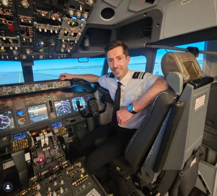 Pilot sitting in airplane cockpit.