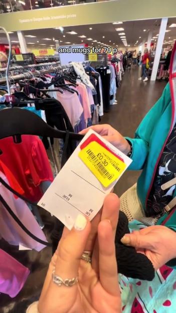 A person holds up a clothing tag showing a price of £0.30 at TK Maxx.