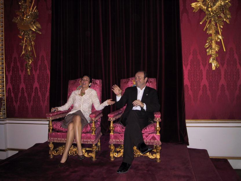 Ghislaine Maxwell and Kevin Spacey seated on thrones at Buckingham Palace.