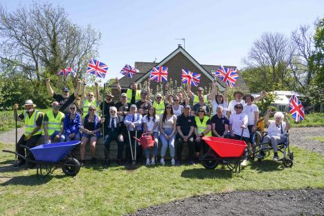 National Lottery millionaires and veterans building a commemorative pathway.