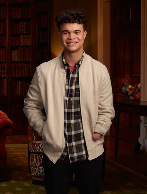Portrait of a smiling young man with one arm.