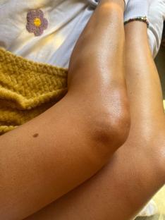 Close-up of tanned legs.