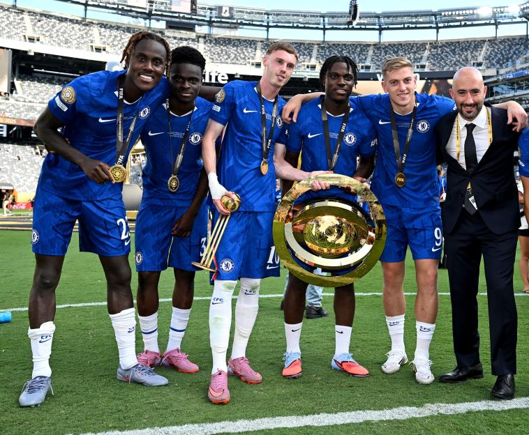 EAST RUTHERFORD, NEW JERSEY - JULY 13: Romeo Lavia #45 of Chelsea FC and teammates poses with the FIFA Club World Cup trophy after his team's victory following the FIFA Club World Cup 2025 Final match between Chelsea FC and Paris Saint-Germain at MetLife Stadium on July 13, 2025 in East Rutherford, New Jersey. (Photo by Darren Walsh/Chelsea FC via Getty Images)