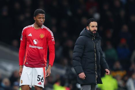 Manchester United player Chido Obi and head coach Ruben Amorim at a Premier League match.