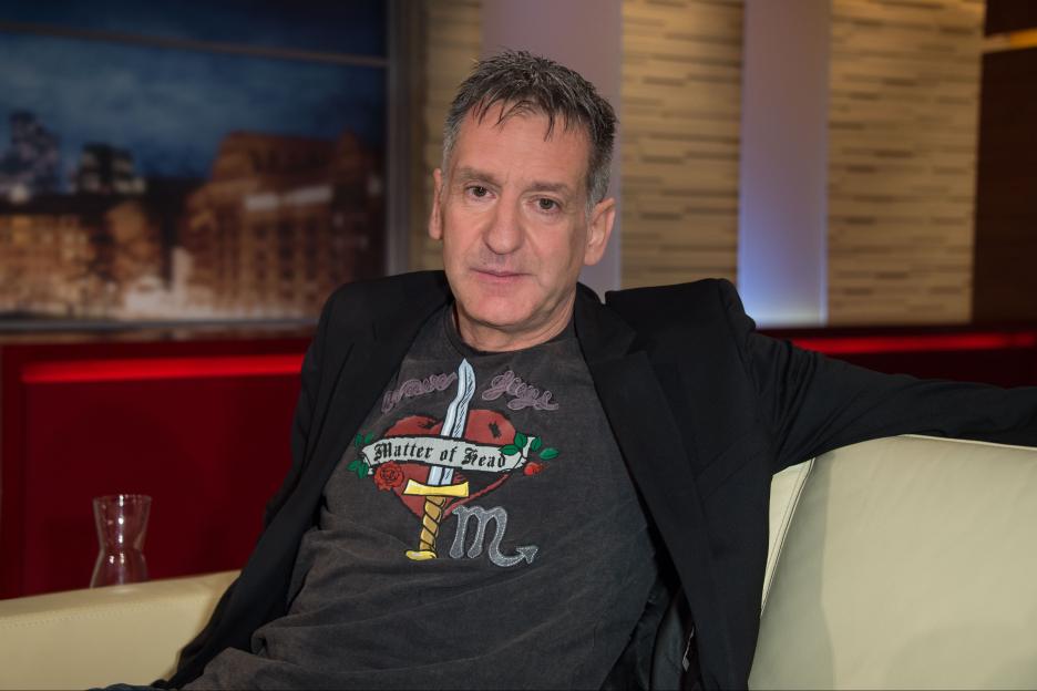 Portrait of former professional football player Eike Immel on a TV show.