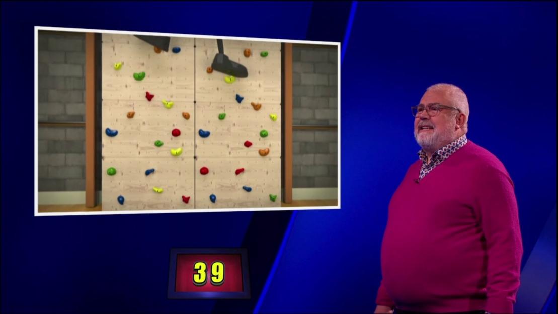Cliff Parisi on Celebrity Catchphrase, shown with a climbing wall image and the number 39.