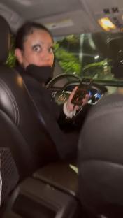 A passenger in an Uber recording the driver.