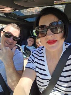 Family selfie in a car.