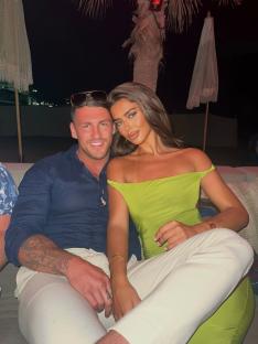 Couple sitting together at night.