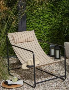 Striped lounge chair outdoors.