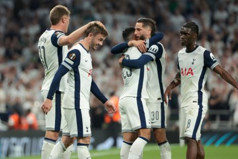 Tottenham Hotspur players celebrating a goal.