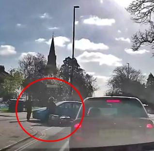 Dashcam footage of a moped colliding with a car.