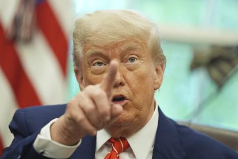 Close-up of Donald Trump gesturing while speaking.