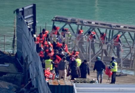 Migrants arriving in Dover, UK, after a Channel crossing.