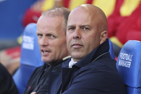 Arne Slot, Liverpool's manager, waits during a soccer match.