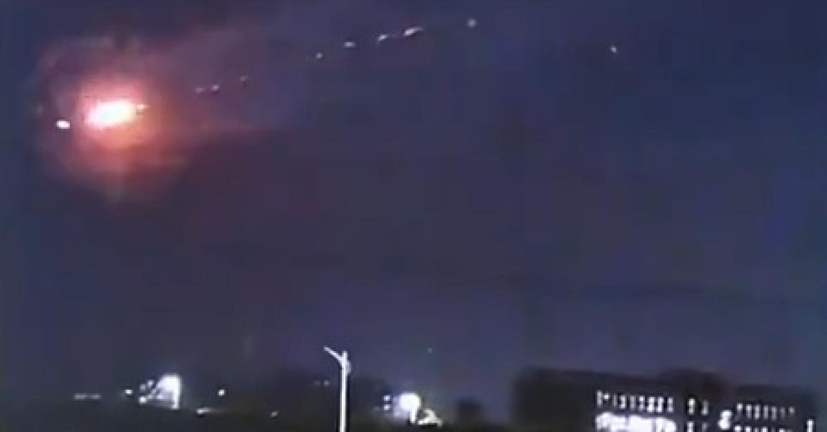 Nighttime video of a bright explosion in the sky.
