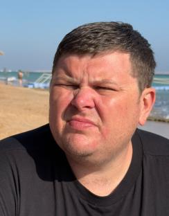 Close-up of a man at the beach.