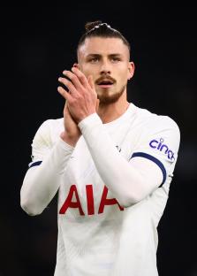 Radu Dragusin of Tottenham Hotspur applauding fans.