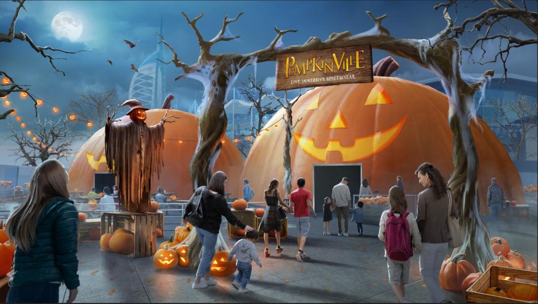 Illustration of PumpkinVille, a live immersive spectacular, with people walking towards large pumpkin structures.