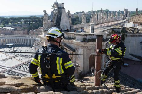 Vatican firefighters on the Sistine Chapel roof preparing for the Papal conclave.