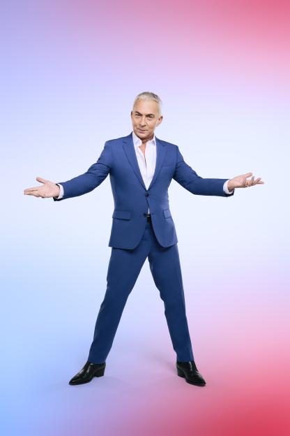 Bruno Tonioli in a blue suit.