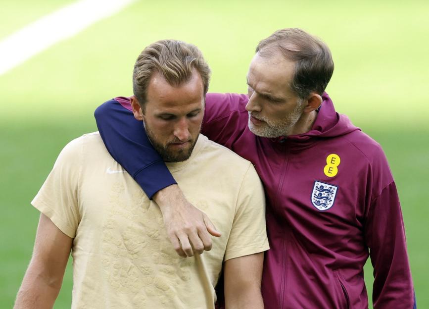 England manager Thomas Tuchel with his arm around player Harry Kane.