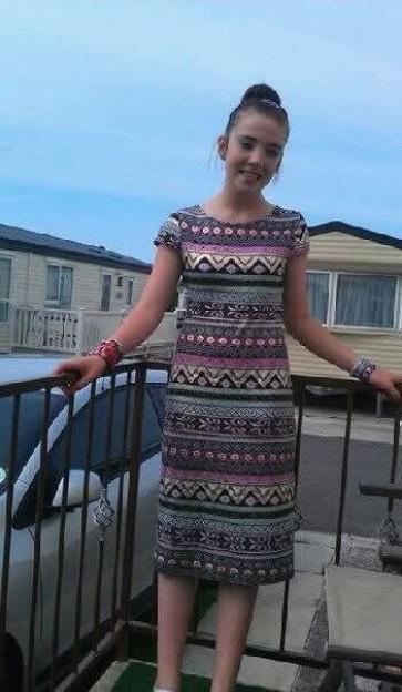 Chelsea Jones, aged 12, smiling and standing outside.