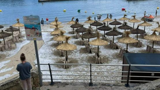 Brit hols hotspot Majorca has beaches turned white with ice and is deluged by rain & hail… with MORE bad weather on way