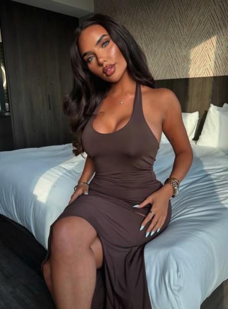 Jazmine Jane Nichol in a brown dress.